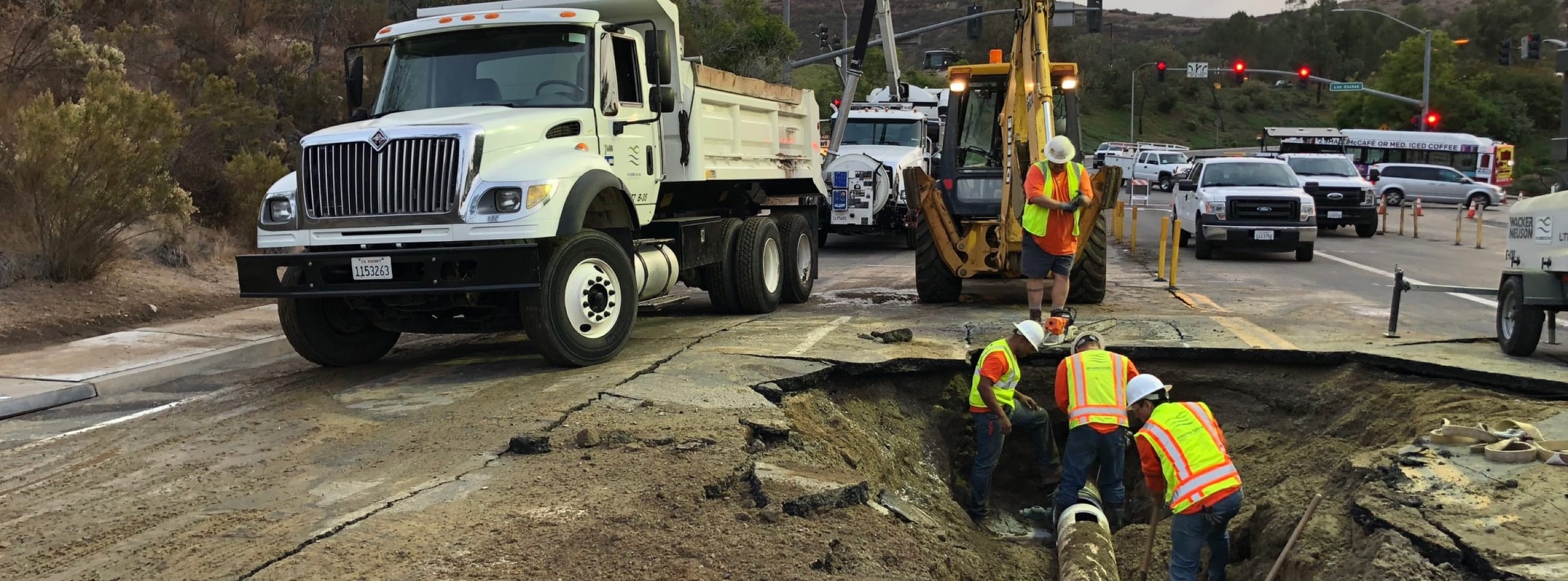 Truck excavating a pipe