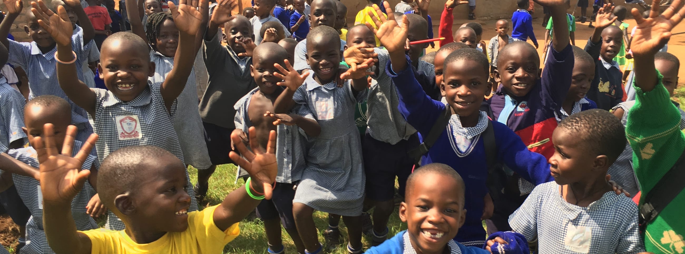 School kids waving hello